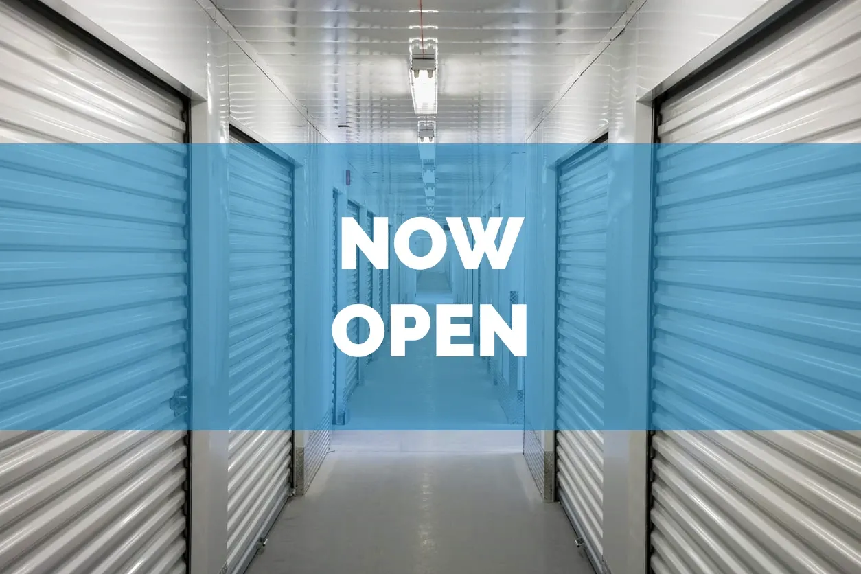 Image of self storage units with Now Open text overlayed in front